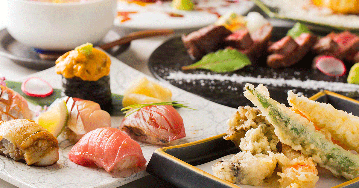 Artfully plated sushi and tempura dishes with fresh seafood and garnishes